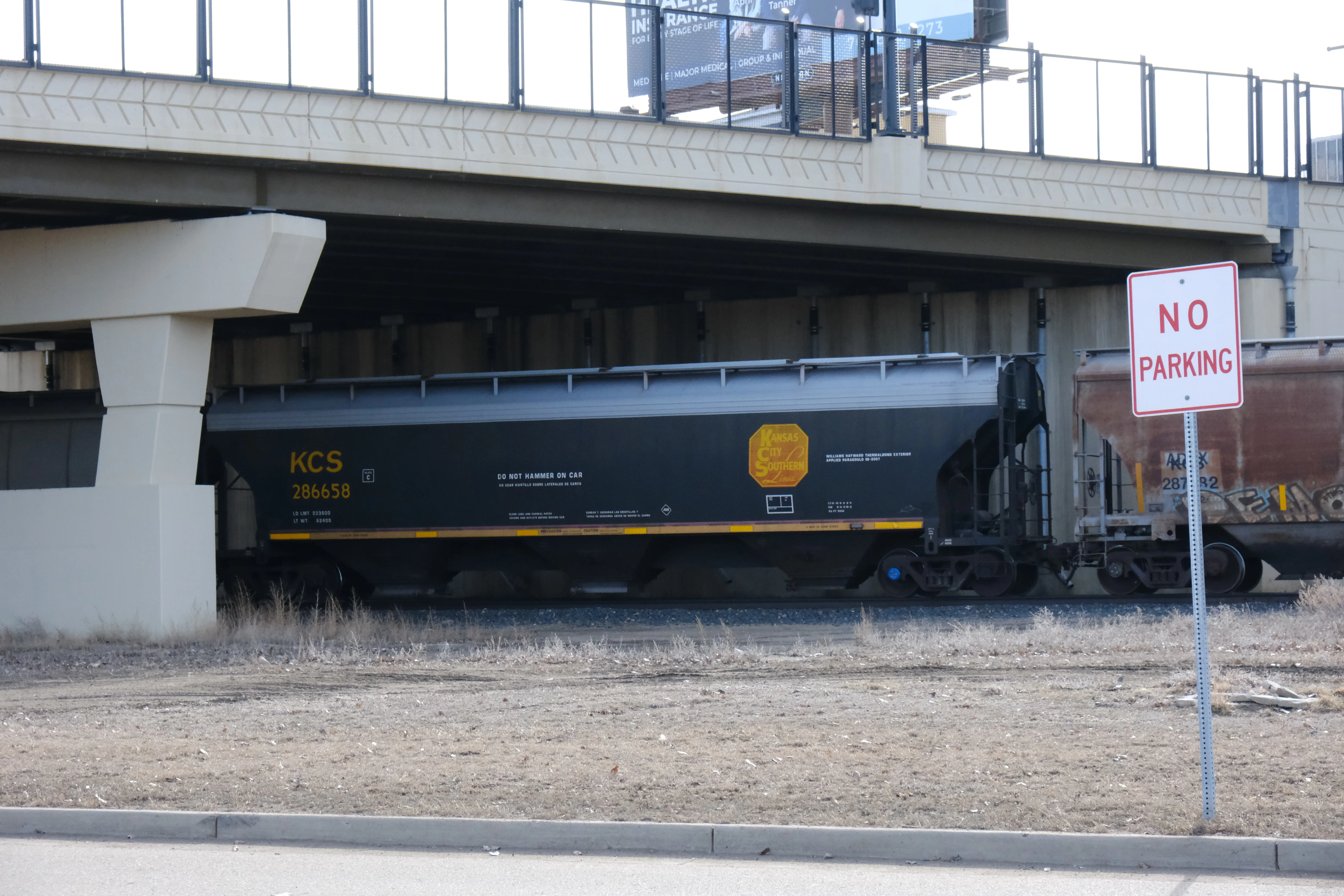 A Kansas City Southern hopper car on a passing train in Minot, North Dakota