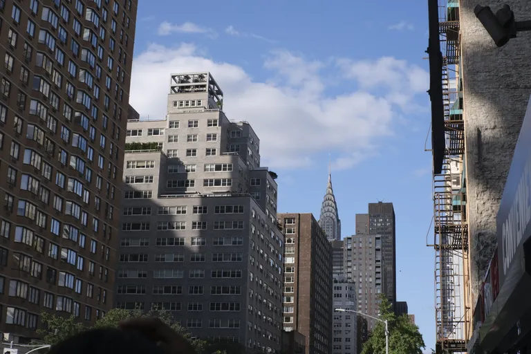 Chrysler Building peeking out from behind other buildings