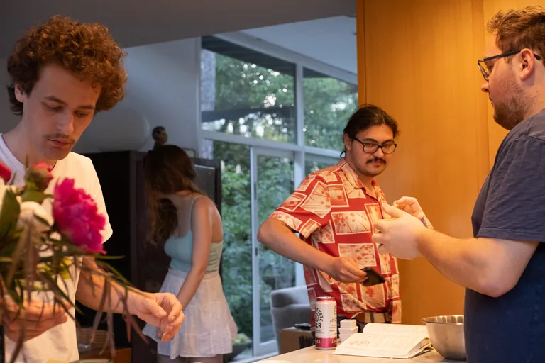 People in a kitchen making food