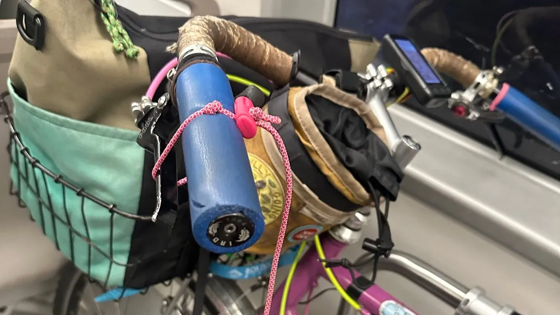 A squeezy bean brake holding Jay's bike still on BART.