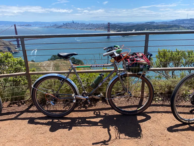 My Mt Fuji leaning against a fence at the top of Hawk Hill in the Marin Headlands. The Golden Gate Bridge and San Francisco skyline are visible.