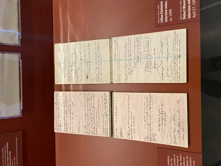 Memo pads open to interview notes. On the left are notes from an interview with Lillian Edelstein, on the right: interview with Robert Moses.