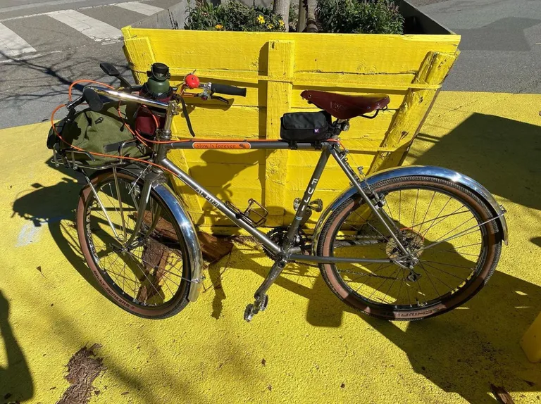 The same bike but with a Brooks leather saddle, Granola Moose bars, and fenders at The Yolk on JFK.