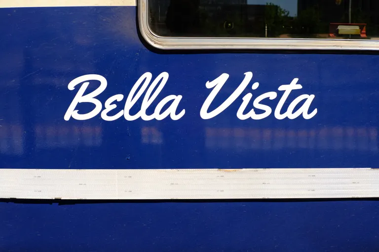 Bella Vista lettering on the side of a private car