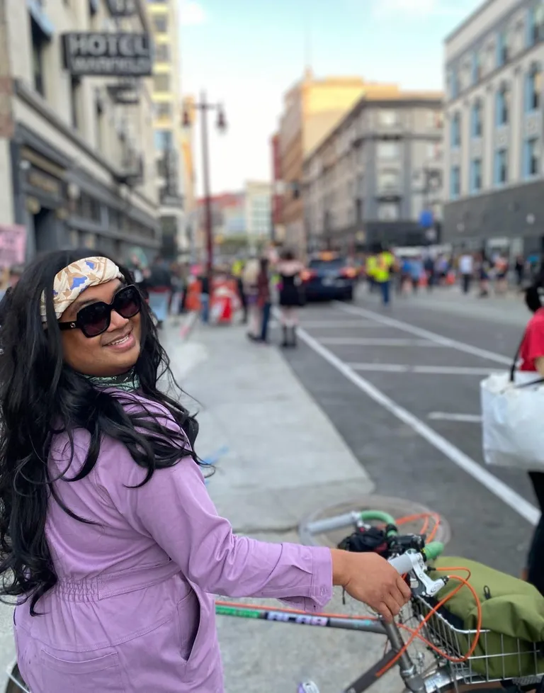 Hansel at Trans March 2023 poses with my bike