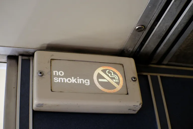 A backlit no smoking sign on the a Superliner